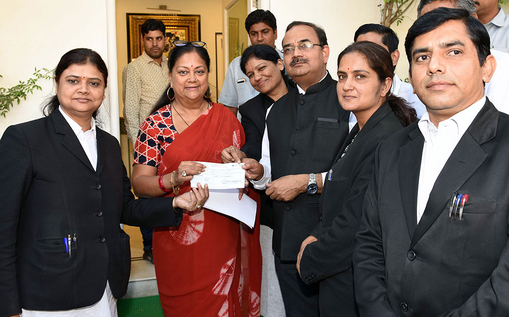 cm receives cheque kerala flood relief